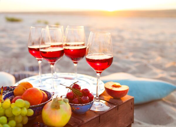 Glasses of the red wine on the sunset